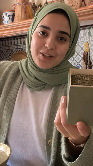 Darija creator showing spices in Marrakech